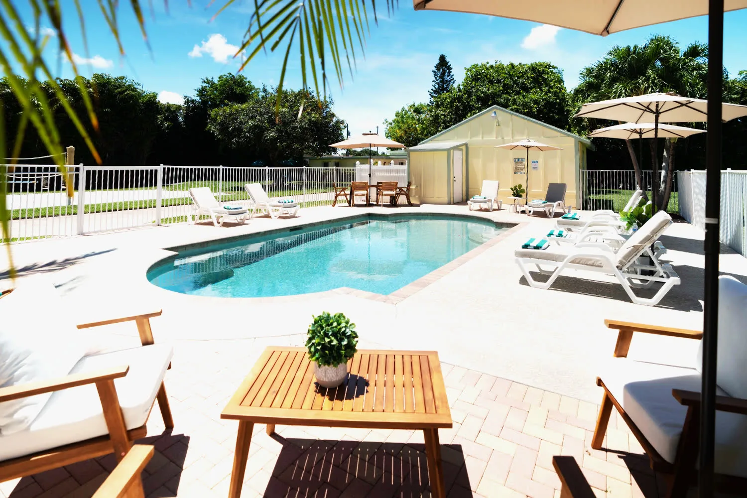 Resort-style pool deck with lounge chairs